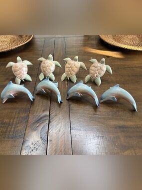 Set of eight wood sea creatures napkin ring holders. Four turtles four dolphins